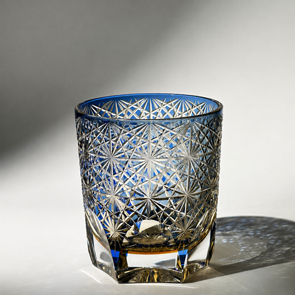 Cobalt blue Edo Kiriko whiskey glass casting starburst shadow reflections
